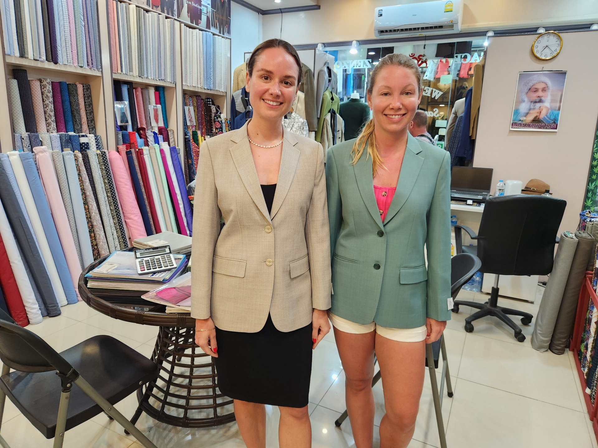 Two customers wearing women's bespoke beige and sage blazers tailored in Karon Beach, Phuket